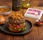 Juicy burger patty topped with caramelized onions, evoking the rich flavor boost provided by Dorot Gardens sautéed onion cubes.