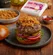 Juicy burger patty topped with caramelized onions, evoking the rich flavor boost provided by Dorot Gardens sautéed onion cubes.
